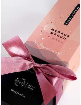 Wrapping the product with a pink ribbon + scent spraying