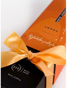 Wrapping the product with an orange ribbon + scent spraying